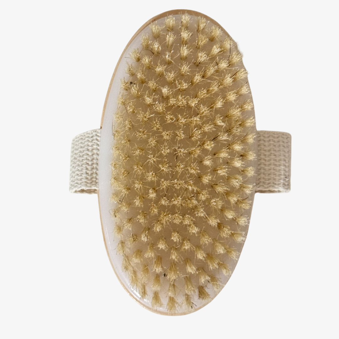 Natural bristle body dry brush with a comfortable strap for effective lymphatic stimulation.