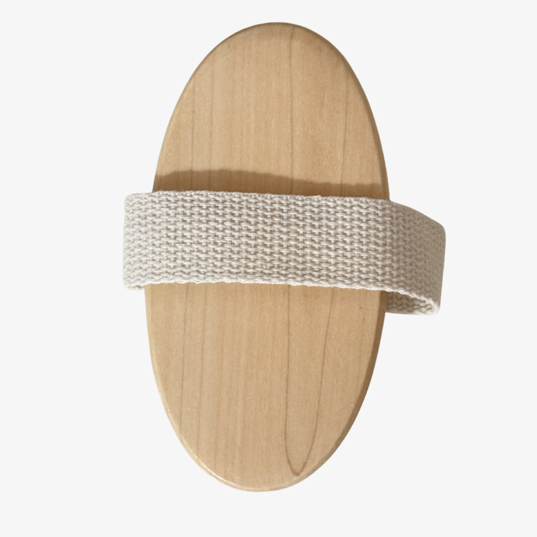natural bristle body dry brush featuring a wooden oval shape and a soft strap for ease of use.