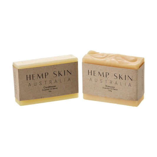 Two bars of Hemp Skin Australia Shampoo bar and Conditioner bar. Plastic free on a white background