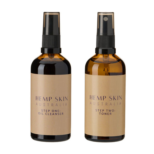 Two bottles of Hemp Skin Australia skincare products Oil Cleanser and Rose Floral Water toner on a white background