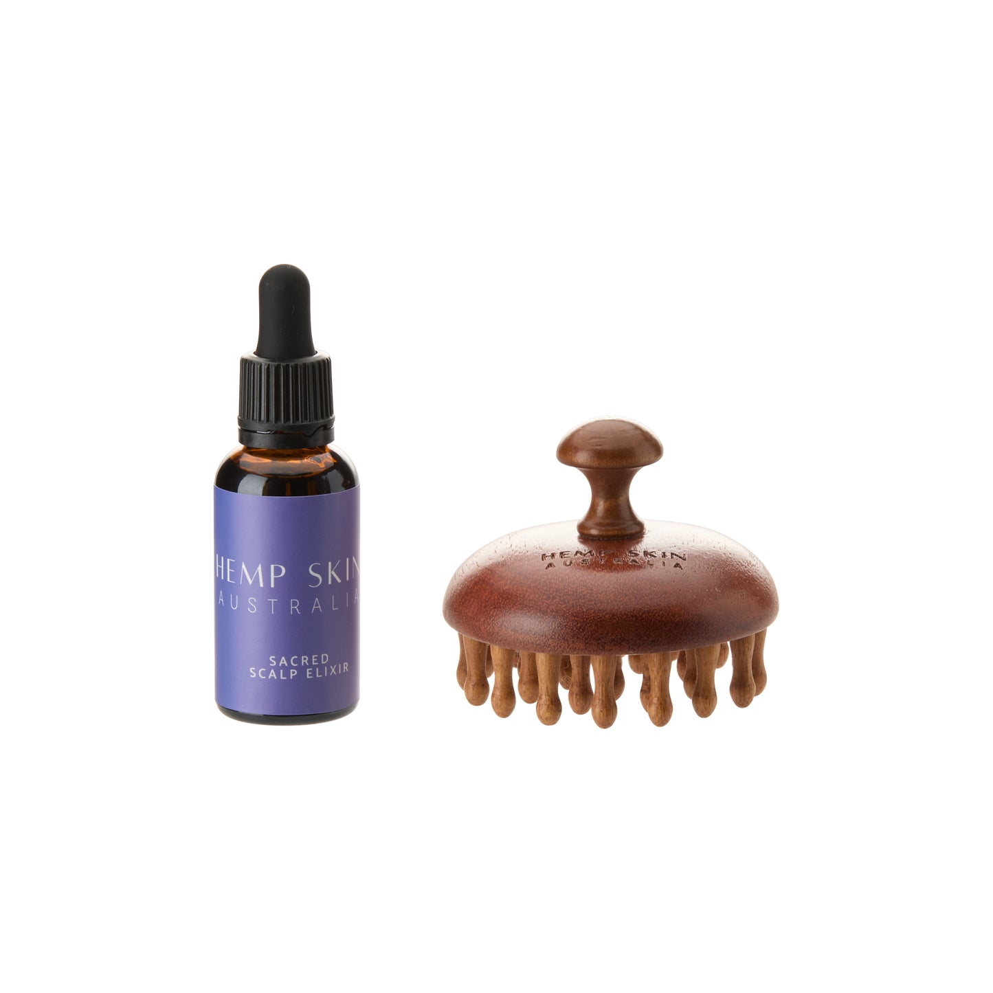 Bottle of Hemp Skin Australia scalp elixir and wooden scalp massager on a white background